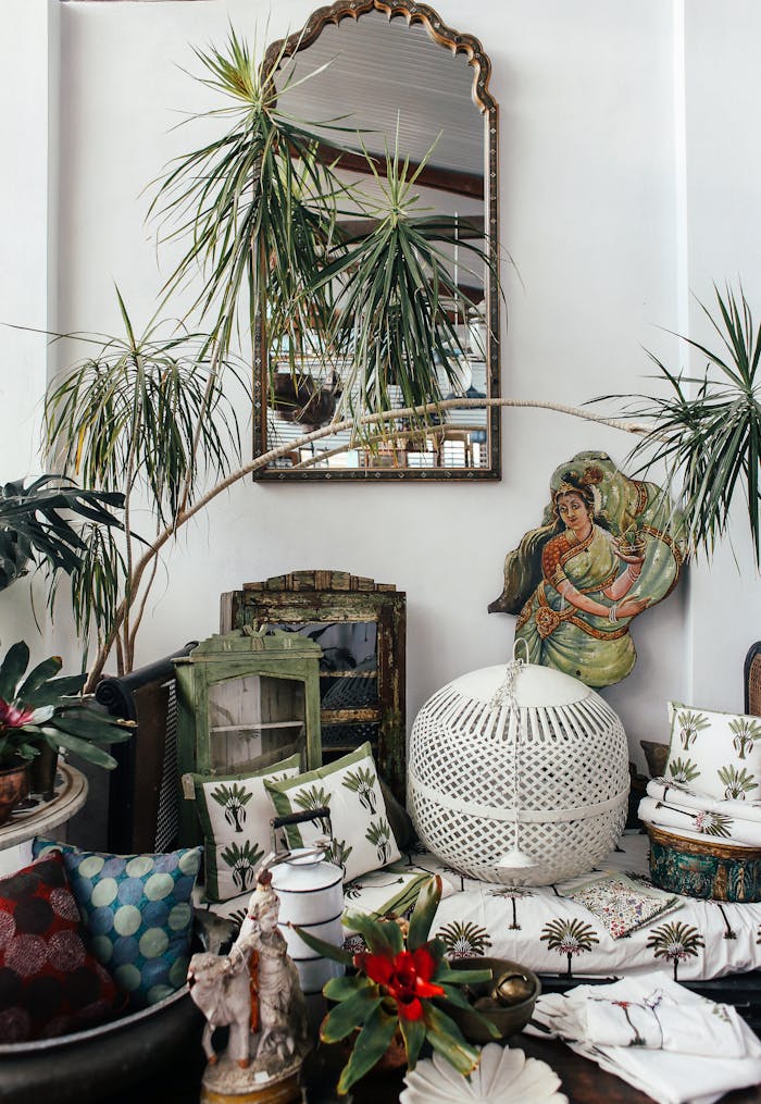 A vibrant bohemian-style room featuring lush houseplants, decorative pillows, and cultural artwork.